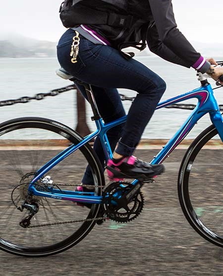 Womens specific hybrid bike on canal towpath